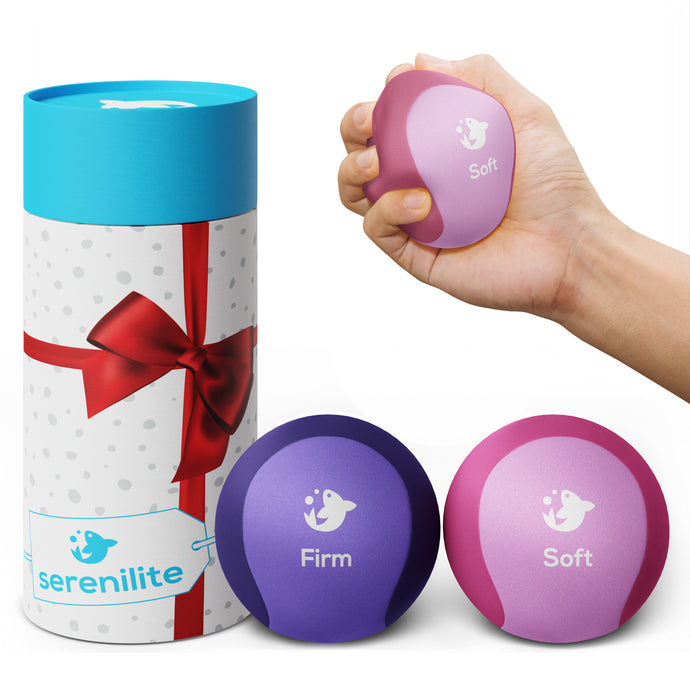 Serenilite soft and firm stress ball set in pink and purple with gift tube, soft ball squeezed in hand