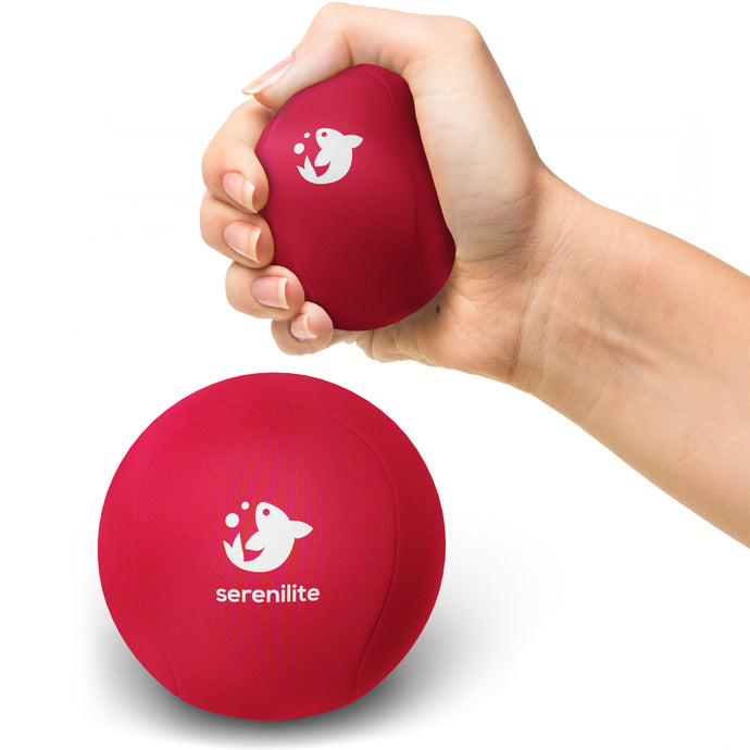 Serenilite Hand Therapy Stress Ball in Rose red, squeezed in hand to show size and soft gel give