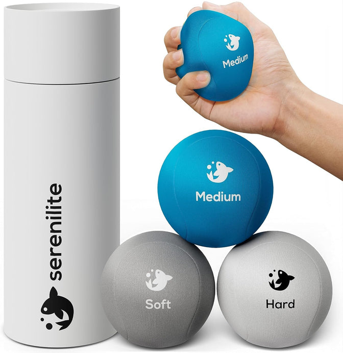 Serenilite Tri-Density Stress Ball Set with soft, medium and hard balls and storage tube, medium ball squeezed in hand